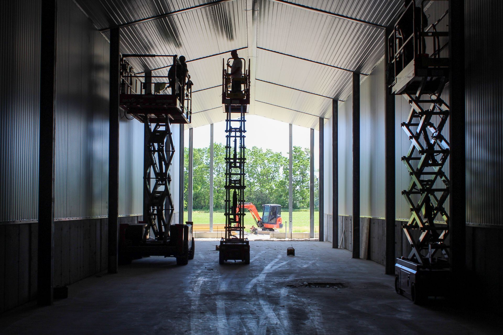 A large warehouse is being built with a lot of windows.