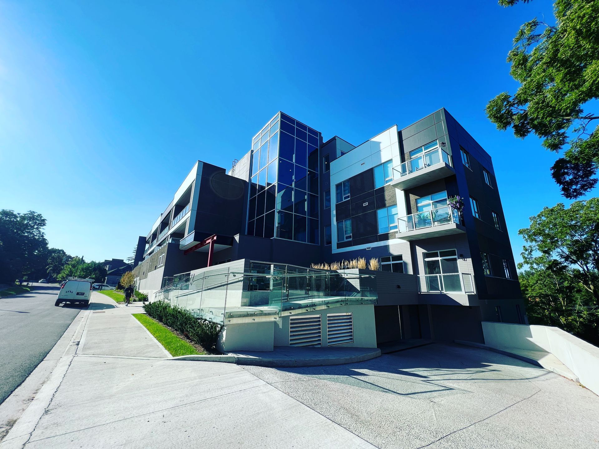 A large building with a lot of windows on a sunny day
