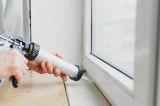 Contractor applies polyurethane foam using a dispenser tool