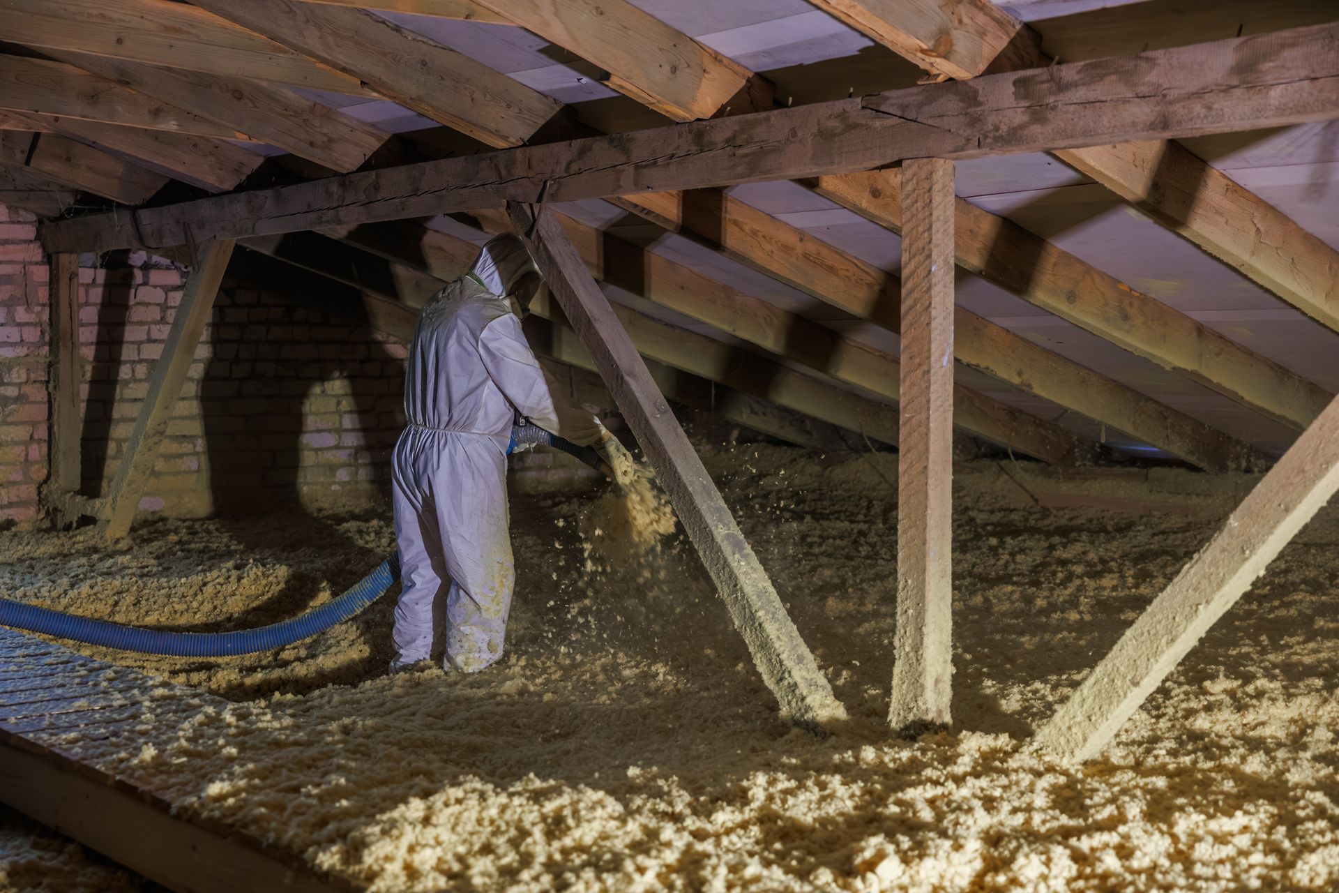 Blown-in cellulose attic insulation being installed in an Appleton, WI home