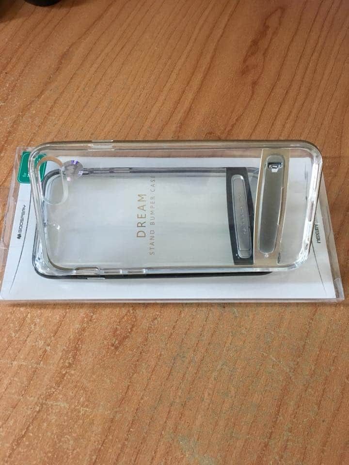 Clear Phone Case With a Built-in Stand, Resting on Its Packaging — Flexicoms Communications in Ingham, QLD