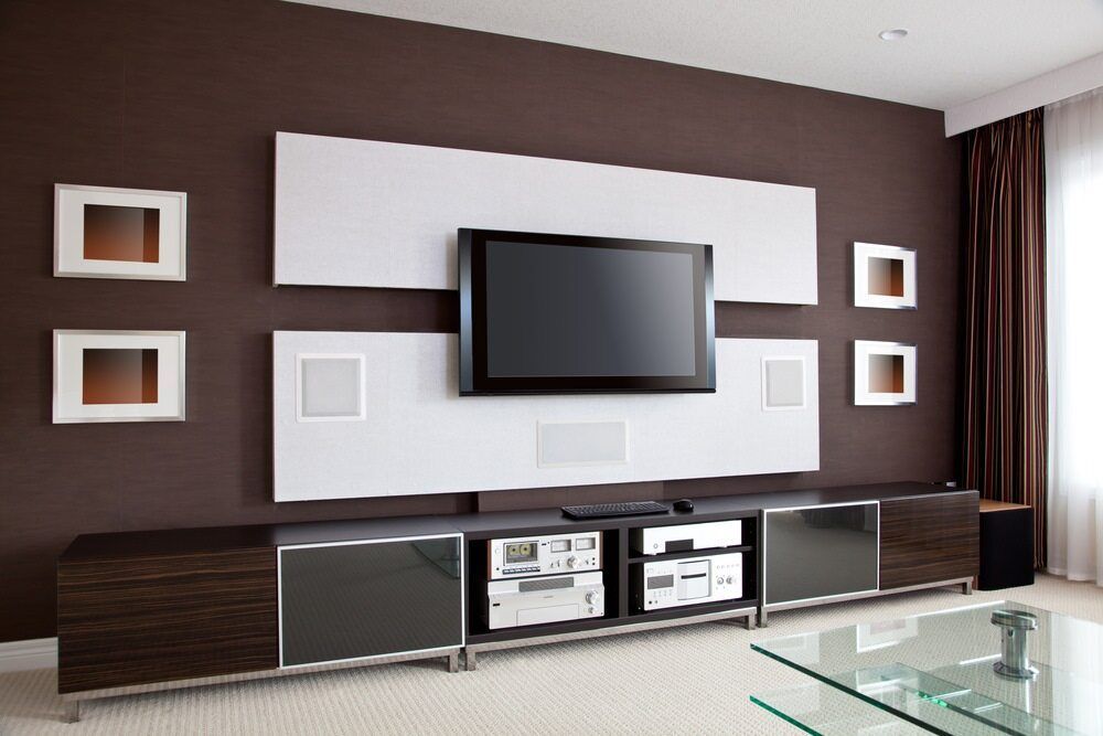Modern Living Room With a Mounted Tv on a White Panel — Flexicoms Communications in Ingham, QLD