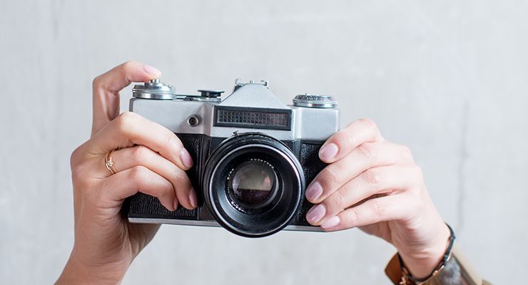Hands holding a camera