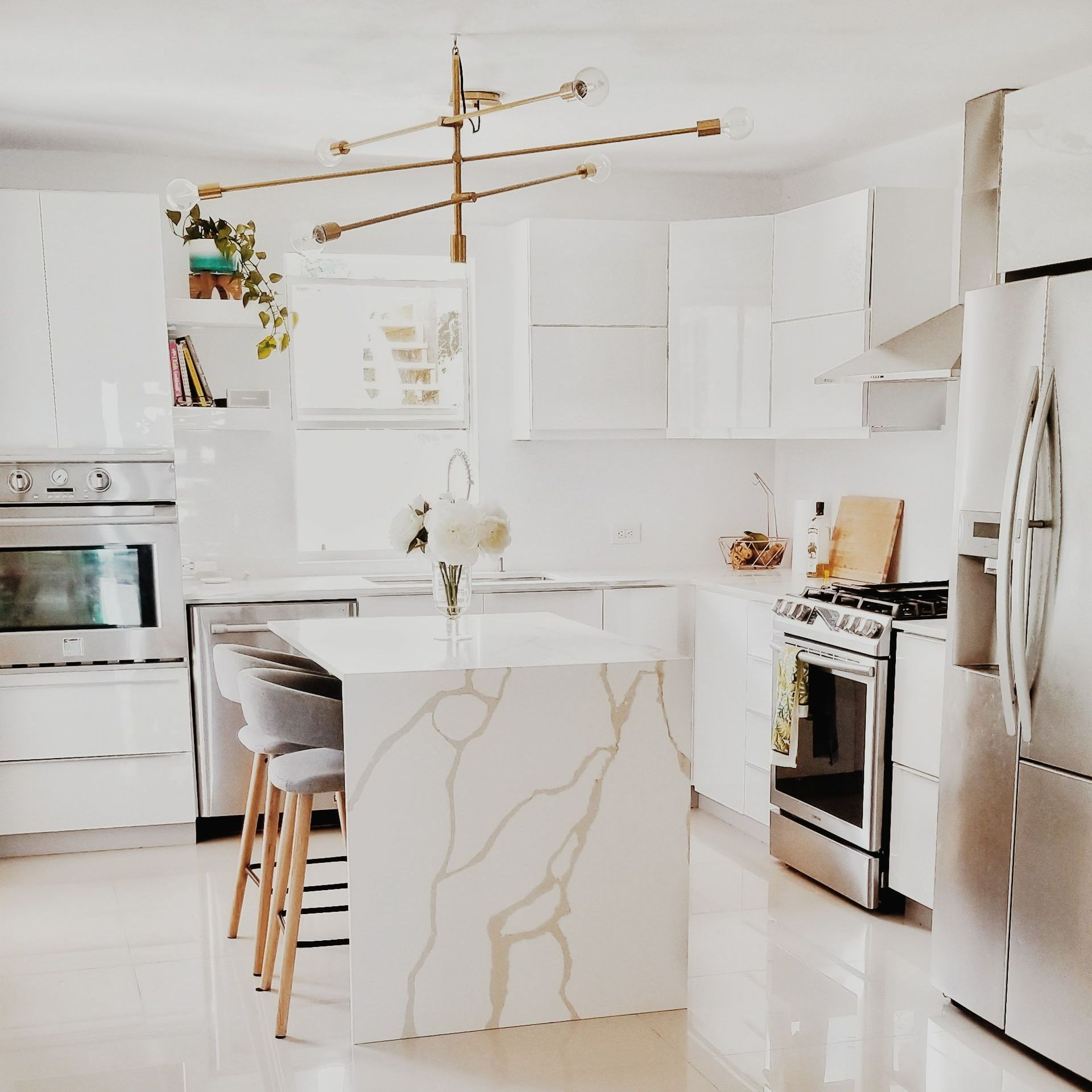A kitchen with white cabinets and stainless steel appliances A kitchen with white cabinets and stainless steel appliances