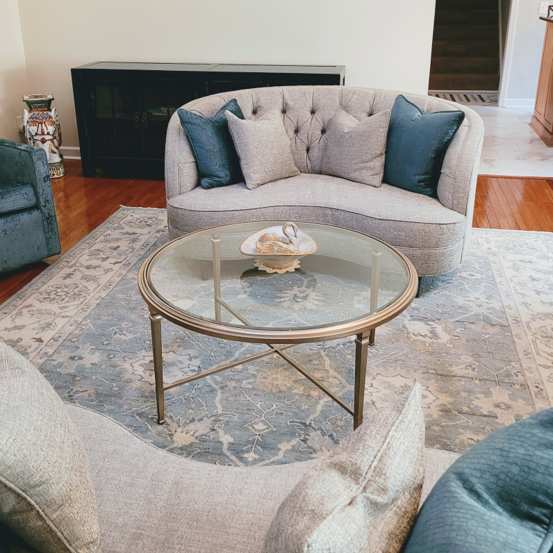 A living room with a couch and a coffee table A living room with a couch and a coffee table
