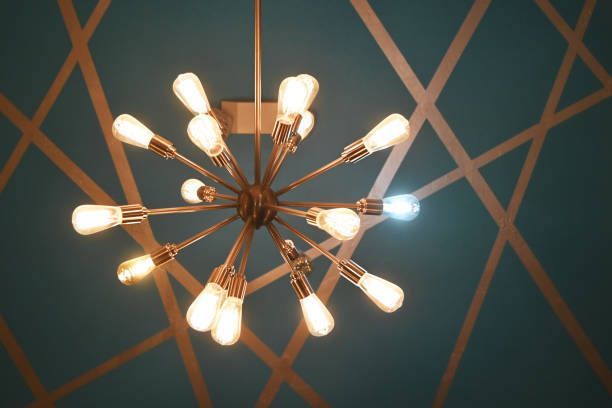 A chandelier with many light bulbs hanging from the ceiling