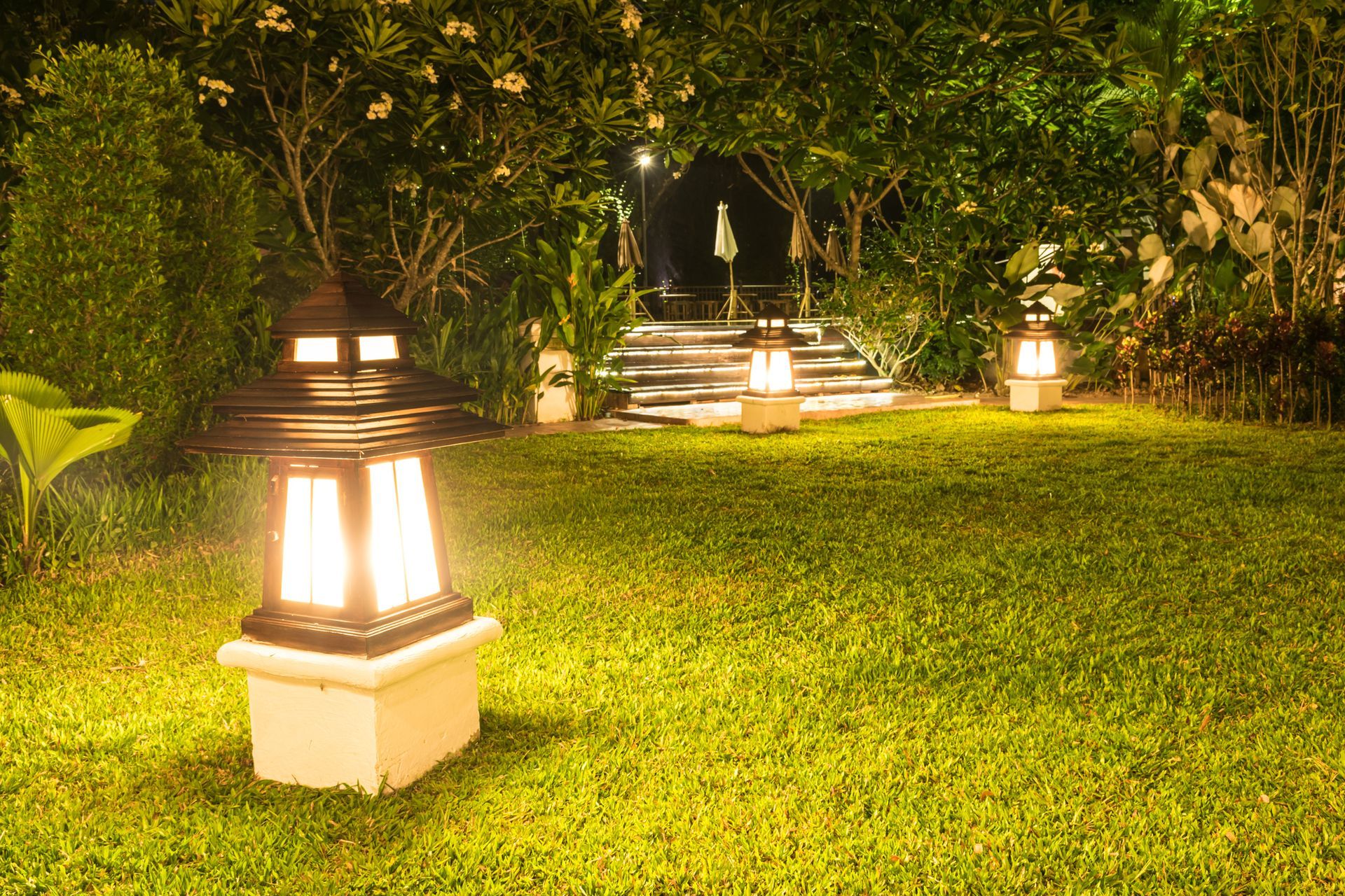 A lawn with a lantern in the middle of it