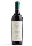 Wine bottle with green cap, white label, dark red liquid.
