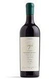 Bottle of red wine with a green top and white label.