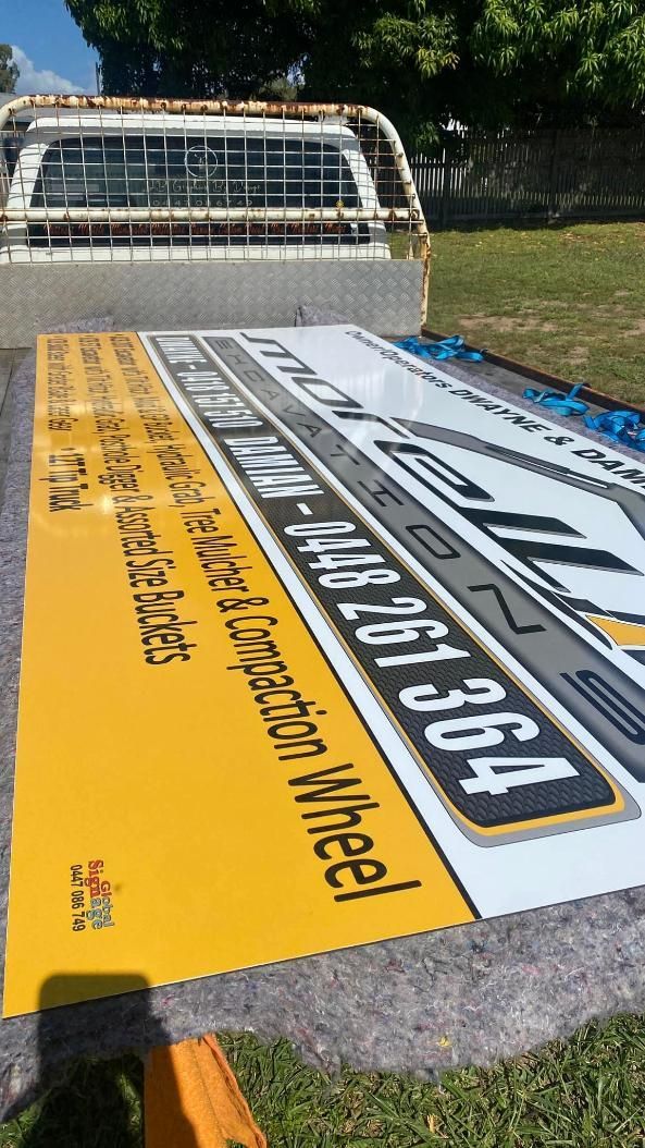 A Truck With a Large Sign on the Back of It — Global Signage In Ingham, QLD