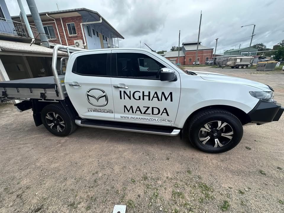 A Cricket Logo is Sitting on Top of a Table in a Room — Global Signage In Ingham, QLD