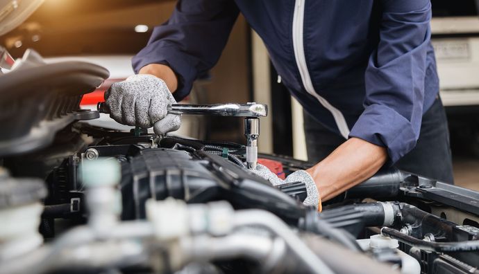 Mechanic Working on a Car Engine — Sydney, NSW — TIPM Automotive