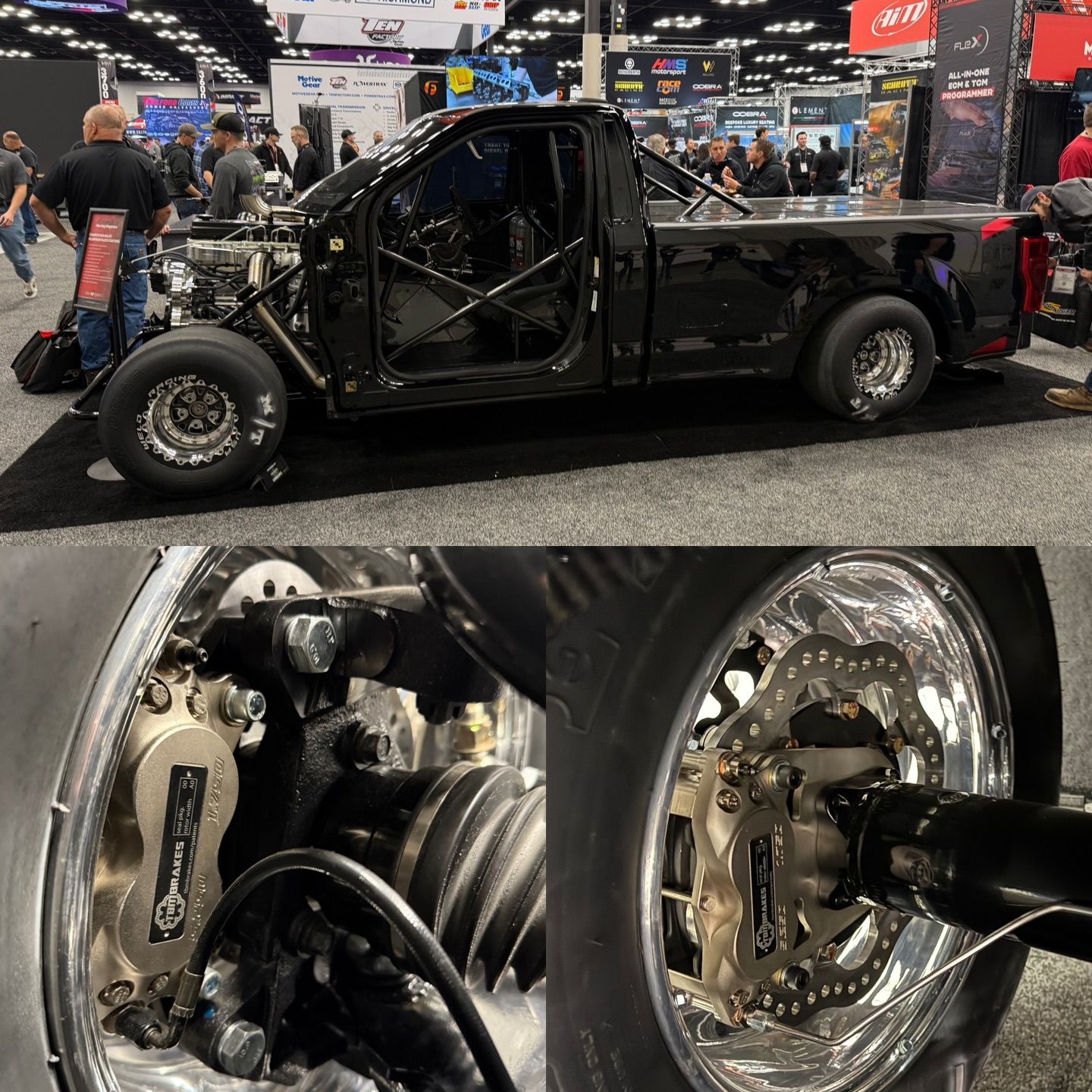 Black custom hot rod pickup at an auto show, with close-up of its exposed rear suspension and wheel hub