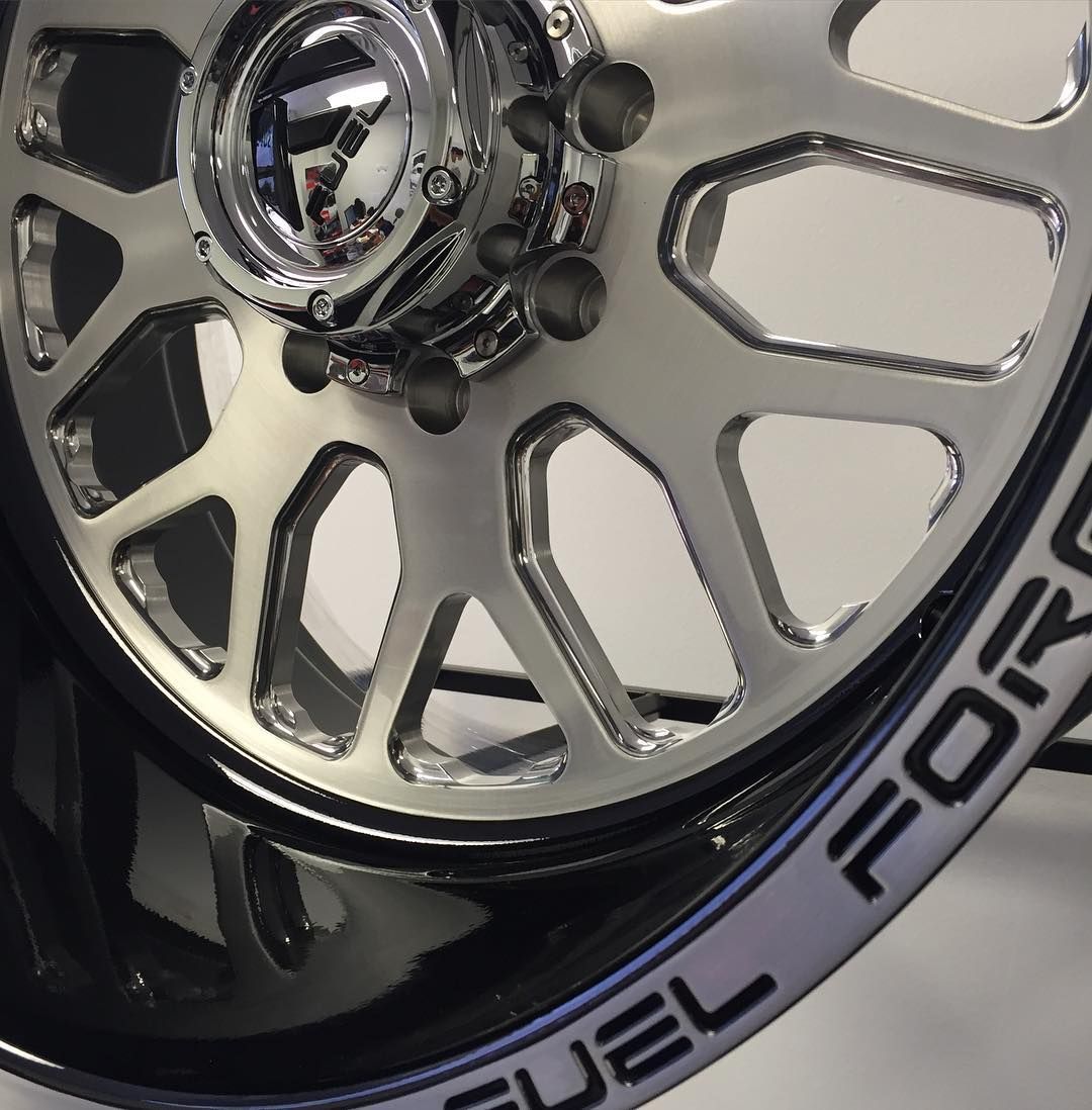 Close-up of a chrome multi-spoke wheel rim with a black tire and FUEL branding on the sidewall.