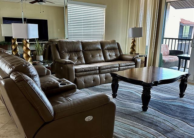 A living room with a couch and a coffee table