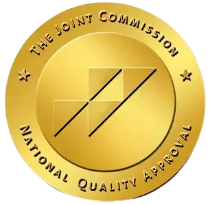 Gold seal reading “The Joint Commission National Quality Approval” with black diagonal lines in center