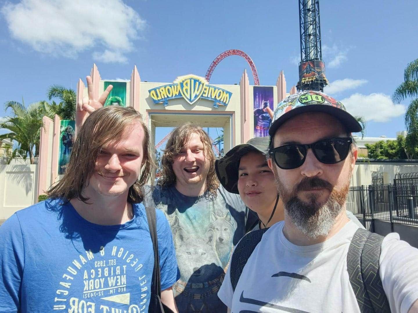 A Group Of People Are Posing For A Picture At A Theme Park — Tailored Support Services Pty Ltd In Maroochydore, QLD