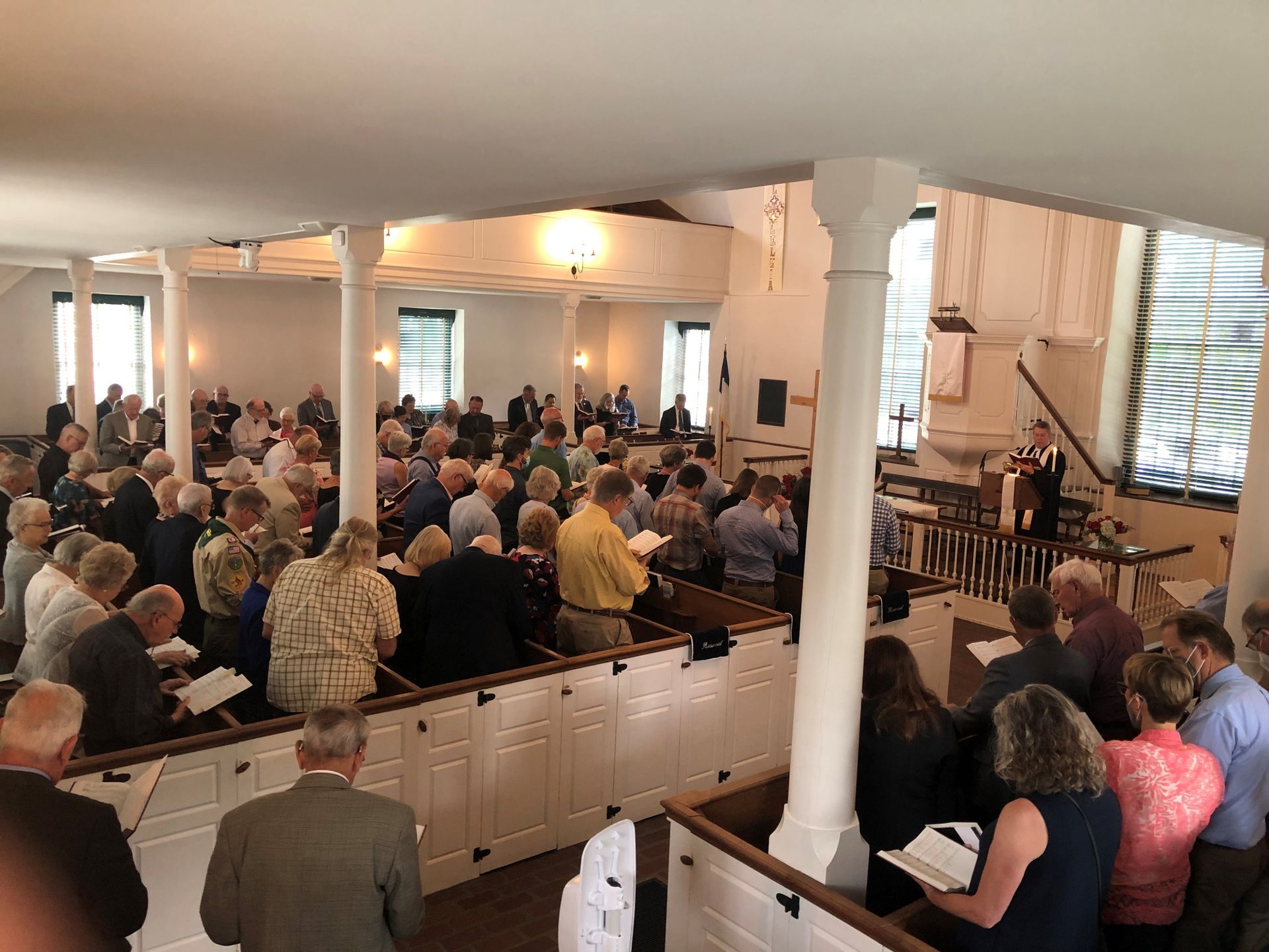 A large group of people are sitting in a church