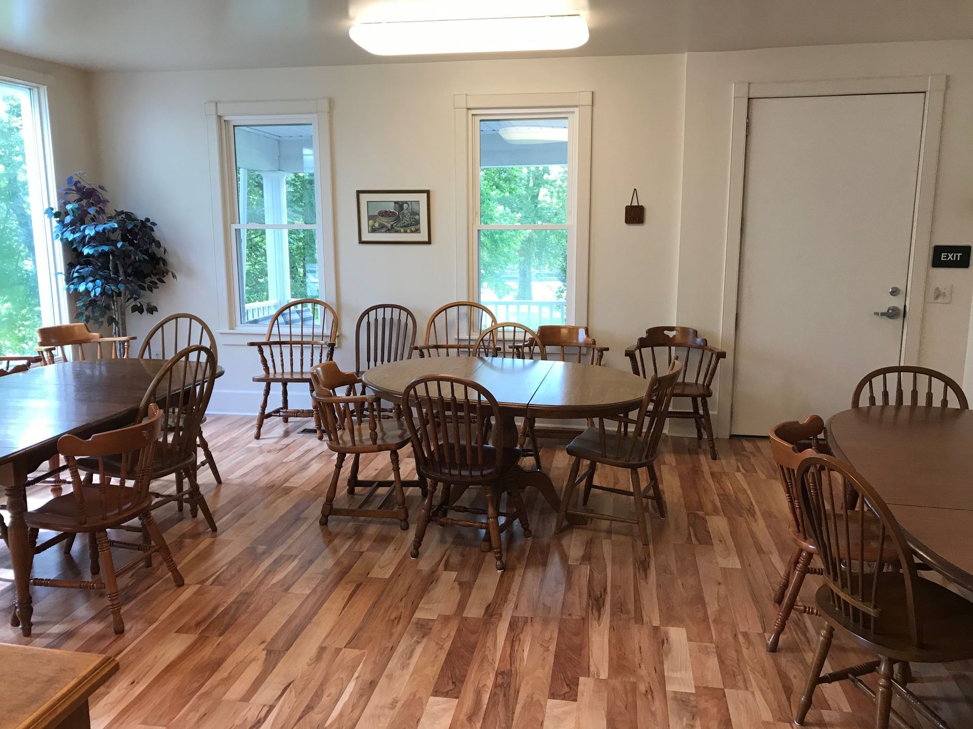 A large room with tables and chairs in it