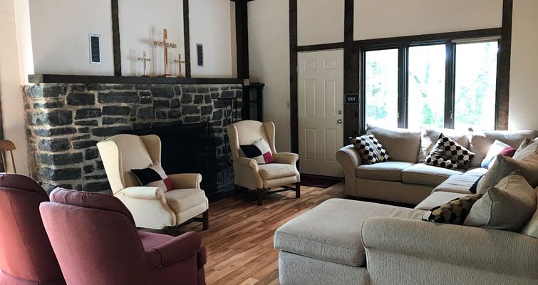 A living room filled with furniture and a fireplace