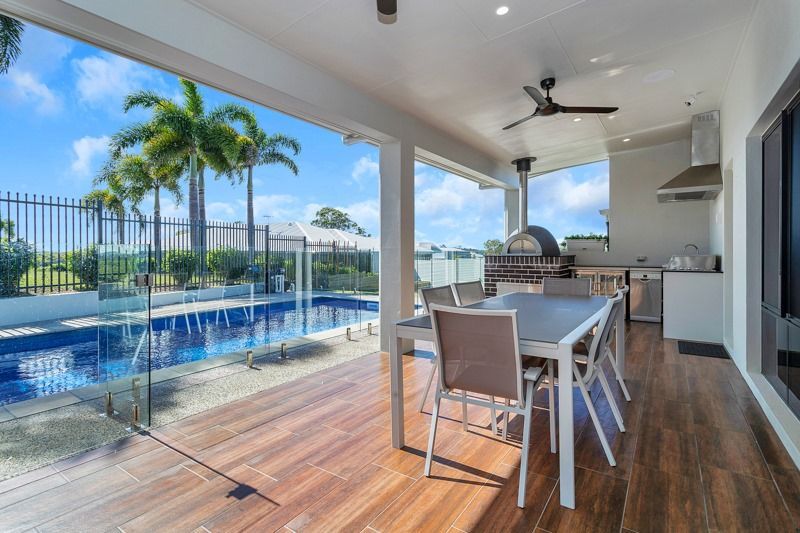 Swimming Pool Area Surrounded by Glass Fence — Local Glaziers in Eton, QLD