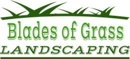 A logo for blades of grass landscaping with a picture of grass
