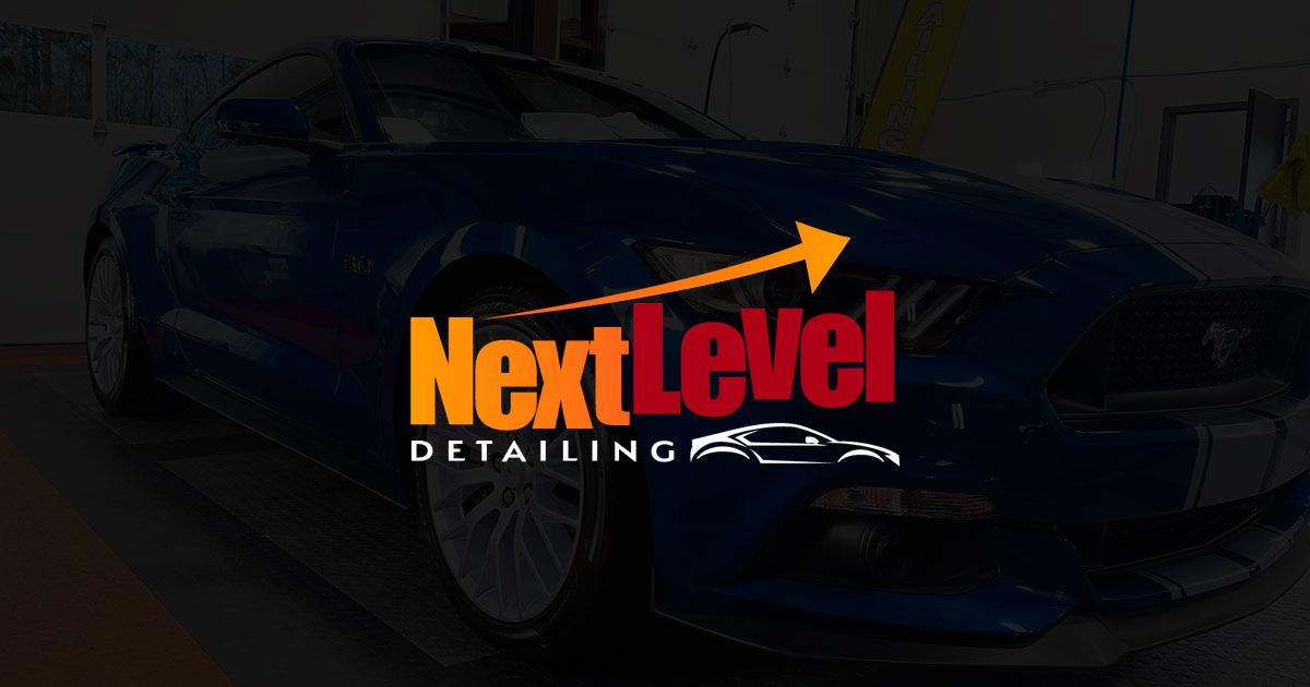 Blue Mustang with Next Level Detailing logo.