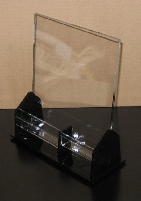 Clear acrylic display stand with black base on a tabletop