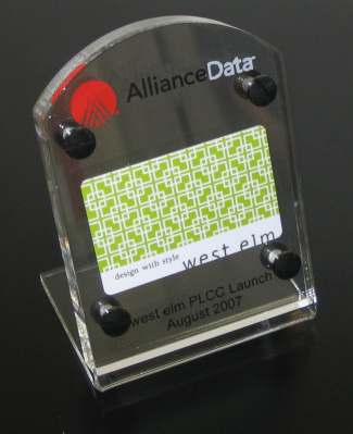 Alliance Data acrylic award plaque with green pattern and black corners on a stand