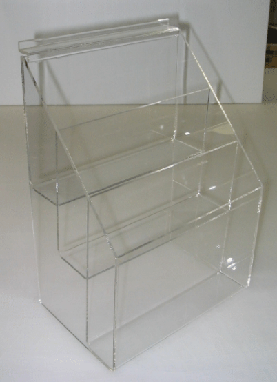 Clear acrylic stepped organizer with three compartments on a white surface