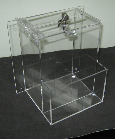 Clear acrylic display box with hinged lid and metal latch on a dark surface.