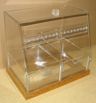 Clear acrylic raffle box on a wooden base, with a top slot and partitioned interior compartments.