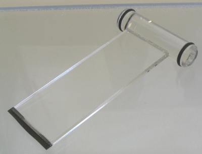 Clear acrylic ramp with black base and round side rollers