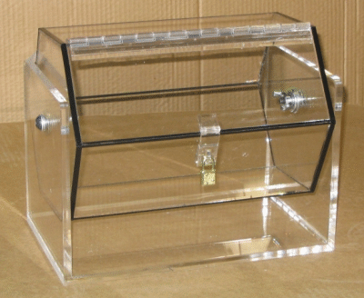 Clear acrylic ballot box with a locking lid and front latch on a wooden surface