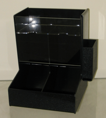 Glossy black display stand with shelves and an open front compartment on a light background