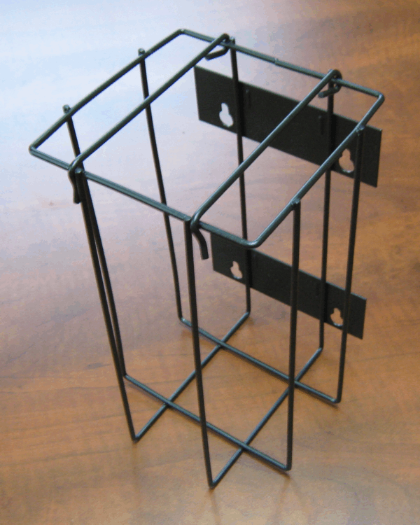 Black wire tabletop brochure holder with three slots on a wooden surface