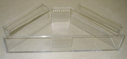 Clear plastic hinged storage box with angled lid and ribbed front edge