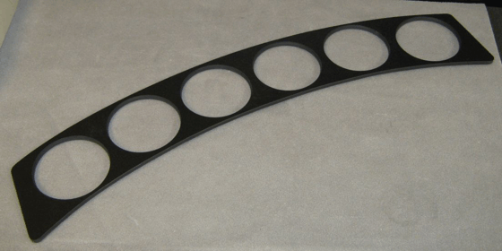 Black curved strip with six circular cutouts on a light background