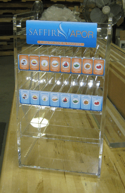Clear acrylic retail display for Safers Vapour products with blue and orange labels