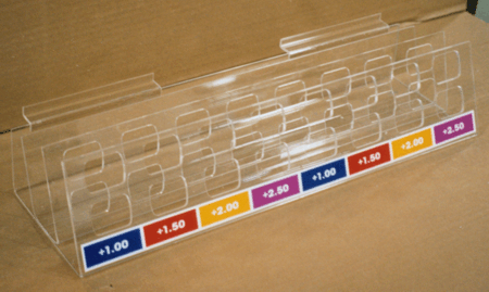 Clear acrylic display rack with colorful labeled price slots on a brown surface