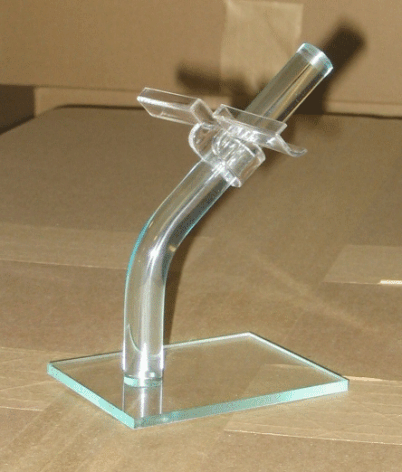 Transparent acrylic display stand with a curved support on a square base