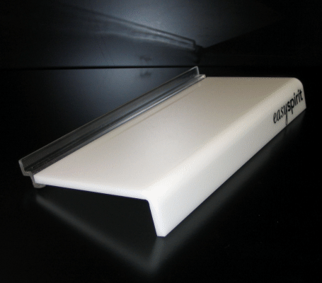 White and black wheeled ramp or skateboard rail accessory on a dark background