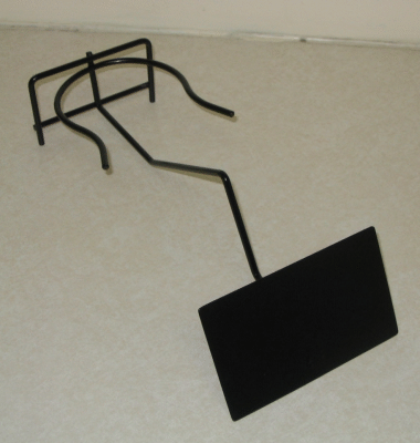 Black metal wire display stand holding a blank rectangular black sign on a light background