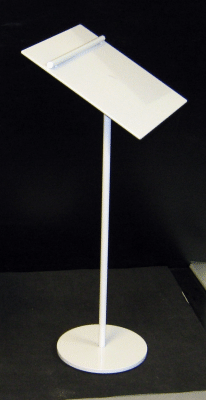 White lectern on a stand with a slanted top and round base against a dark background