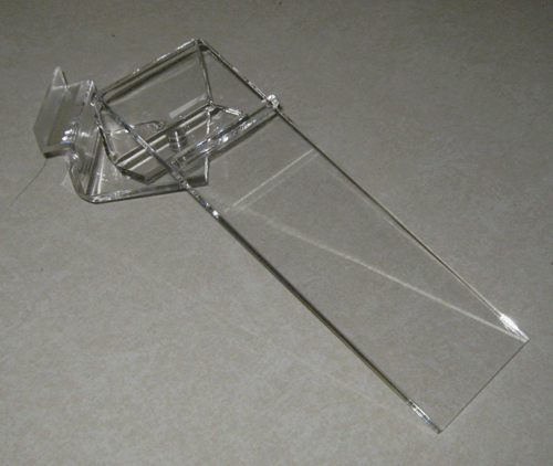 Clear plastic folding paper tray on a gray surface
