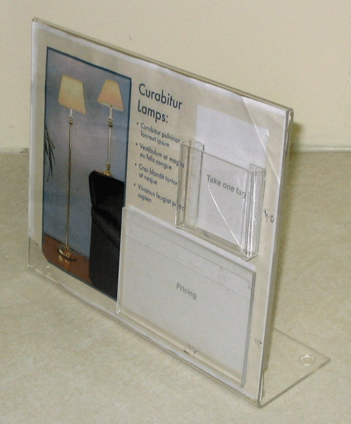 Clear acrylic display stand holding a booklet or brochure against a beige wall.