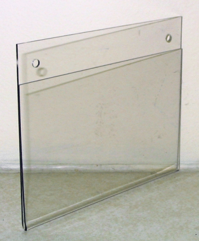 Clear acrylic wall sign holder with two mounting holes and a thin black edge on a light surface