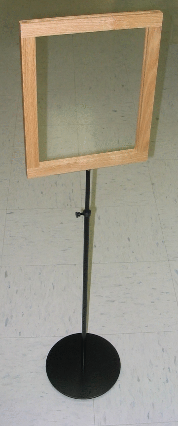 Wooden-framed sign stand with black base and pole, empty display panel