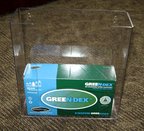 Green and blue GREENDEX box inside a clear plastic display case