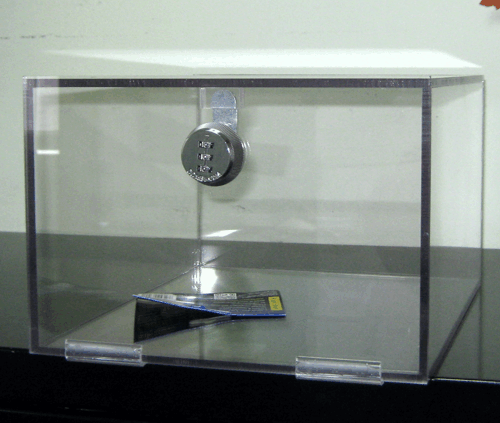 Clear display case with a combination lock on the front and a small brochure inside.
